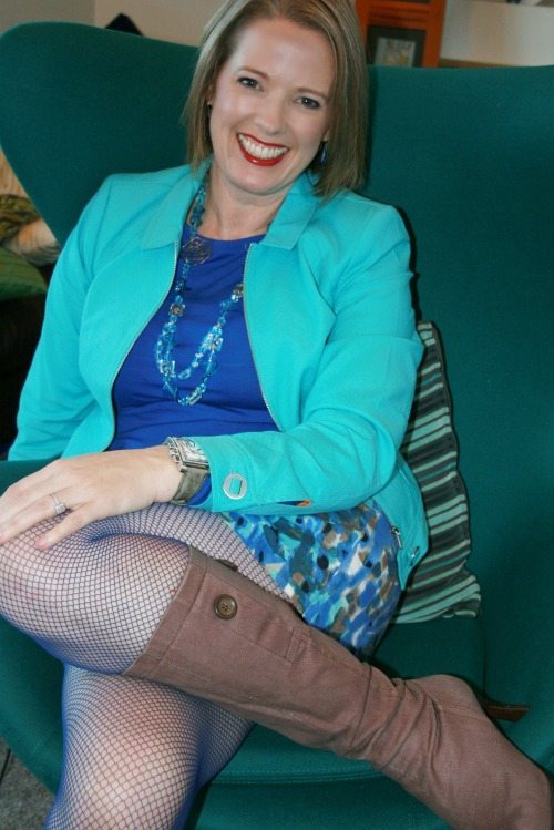 Wearing a blue fishnet tight with a light rose brown boot. 