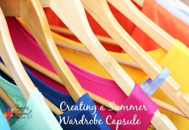 Clothes on circle hanger on light background summer wardrobe capsules, column of colour