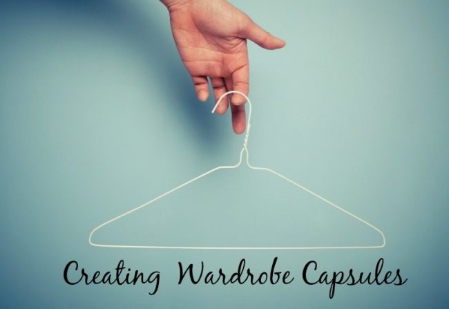 A Hand is holding a wire hanger