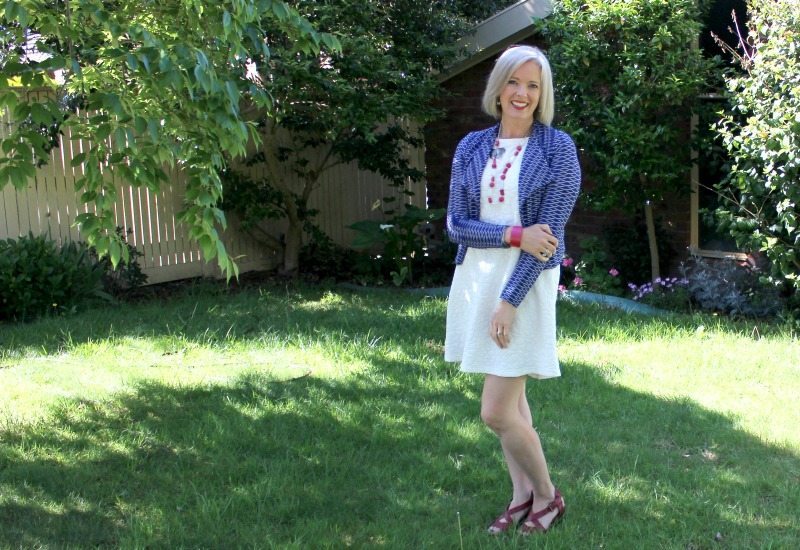 blue jacket, white dress red accessories