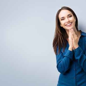 happy gesturing smiling young woman, with copyspace happy gesturing smiling young woman, with copyspace