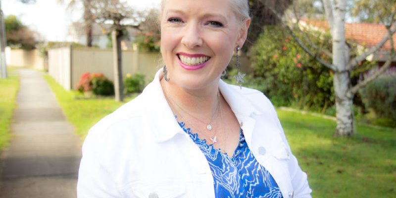 how to choose your best neutrals Woman wearing white denim jacket and blue top with patterns