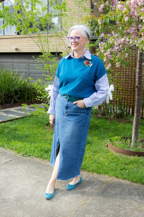 Striped shirt - was classic except the bows at the elbows add in an element of both feminine and creative, paired with relaxed denim skirt, feminine ballet flats and a dramatic brooch